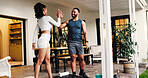 Couple, happy and fitness in home, high five or support with smile for training, motivation and workout. People, man and woman with celebration for exercise, success and cheers for goals at apartment