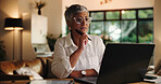 Mature woman, laptop and remote work from home with decision, review or notes for project management. Person, virtual assistant and computer with insight, feedback and freelance career at apartment