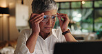 Mature woman, glasses and night with eye strain on laptop for wrong prescription or frame at home. Female person, lens or working late with poor sight, headache or stress for bad optometry at house