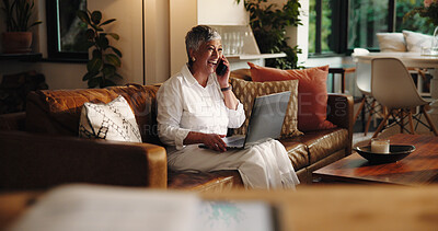 Buy stock photo Mature, happy woman and laptop with phone call on sofa for discussion or conversation at home. Female person, freelancer or remote work with laugh on computer or mobile smartphone for humor or comedy