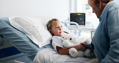 Buy stock photo Girl, senior woman and teddy bear in hospital bed with support, comfort and love for recovery. Grandmother, child and patient with plush toys, visit and gift for rehabilitation with illness at clinic