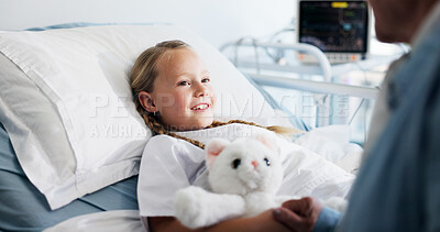 Buy stock photo Happy, doctor and child on bed in hospital for healthcare medicine, support and trust. Paediatrician, holding hands or girl patient with teddy bear at paediatrics clinic for help, empathy or comfort