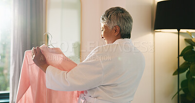 Buy stock photo Mature woman, shirt and choice in mirror of bedroom for getting ready, planning clothes and style. Happy, fashion and person in home with blouse for garment decision, outfit selection and start day