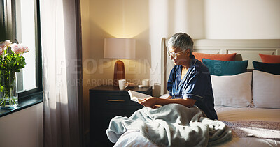 Buy stock photo Reading, relax and senior woman with story on bed in home with hobby, literature or knowledge. Peace, fiction and elderly female person in retirement enjoying fantasy book in bedroom of apartment.