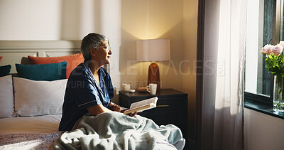 Buy stock photo Reading, thinking and senior woman with book on bed in home with hobby, literature or knowledge. Relax, fiction and elderly female person in retirement enjoying fantasy story in bedroom of apartment.