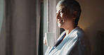 Senior, happy woman and morning with coffee by window for day dreaming, vision or memory at home. Female person, relax and smile with cup or mug of caffeine in wonder or thought for fresh start