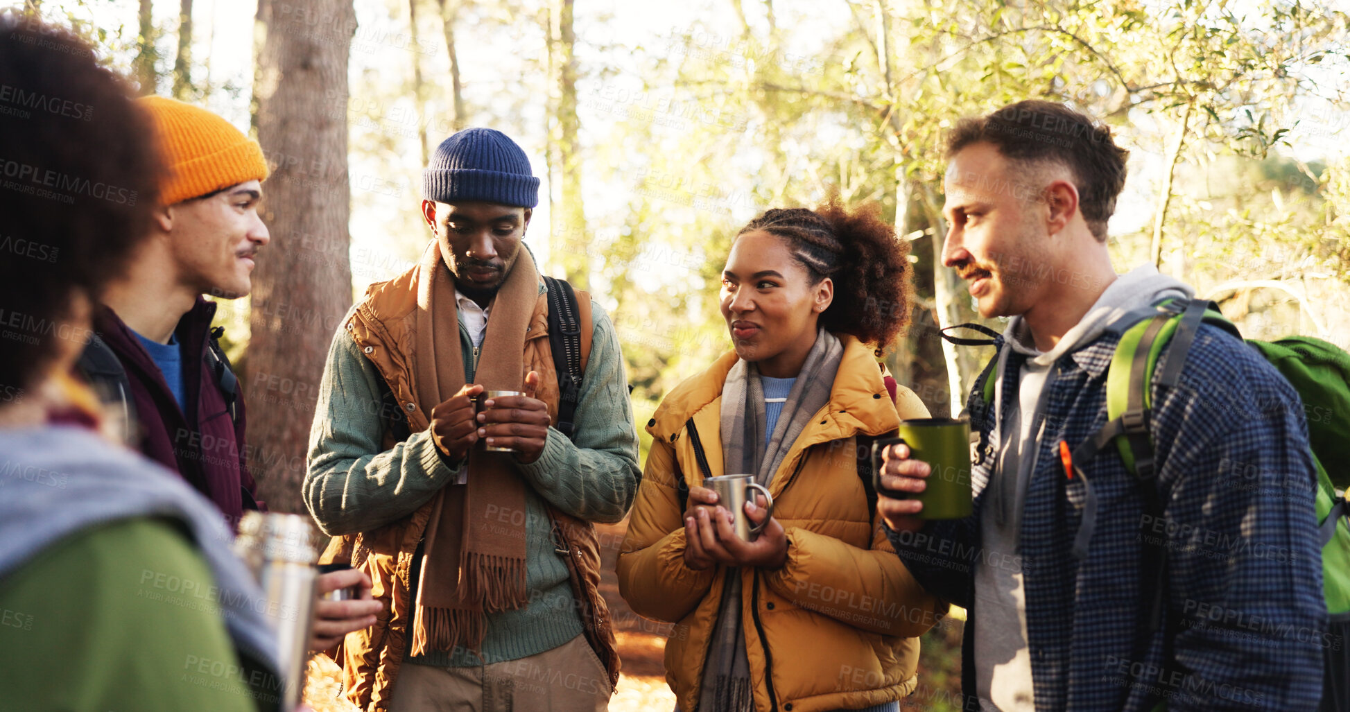 Buy stock photo Hiking, friends or group with coffee in forest for trekking break, travel adventure or conversation. Backpacking, backpack and people with warm drink for winter journey, bonding together or diversity