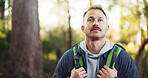 Thinking, hiking and man with fitness, outdoor and energy with holiday, hobby and weekend break. Trekking, person and hiker in woods, contemplation and travel with environment, nature and explore
