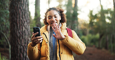 Buy stock photo Woman, video call and hiking in forest with smile, wave and social media with adventure in nature. African person, smartphone and influencer in woods on mobile app, live stream or trekking in Nigeria