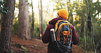 Travel, hiking and back of man in nature for trekking, adventure and wilderness explore. Eco tourism, backpack and journey with person walking in forest for vacation, peace and wellness trip