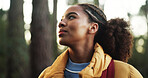 Thinking, hiking and woman in forest, journey and energy with fitness, hobby and weekend break. Outdoor, person and hiker in woods, contemplation and travel with environment, nature and holiday