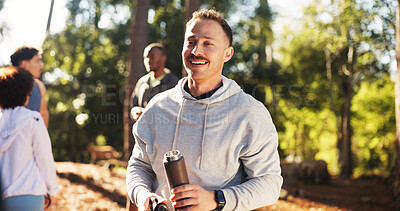 Buy stock photo Marathon, man and water bottle in forest for fitness, workout and endurance for health. Cardio club, running group and hydration for competition, practice and team exercise for training together