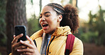 Woman, video call and hiking in forest with phone, happy and social media with adventure in nature. African person, smartphone and smile in woods with mobile app, live stream and trekking in Nigeria