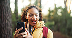 Woman, video call and hiking in woods with phone, happy and social media with adventure in nature. African person, smartphone and influencer in forest on mobile app, live stream or trekking in Kenya