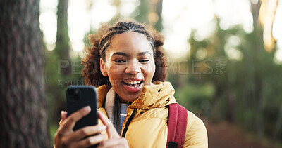Buy stock photo Woman, video call and hiking in woods with phone, happy and social media with adventure in nature. African person, smartphone and influencer in forest on mobile app, live stream or trekking in Kenya