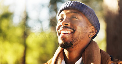 Buy stock photo Thinking, smile and hiking with black man in forest, ideas and decision for travel destination. Male person, contemplation and planning for backpacking, trekking route and reflection of fitness hobby