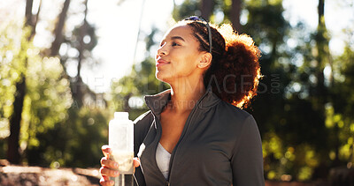 Buy stock photo Happy woman, thinking and forest with water bottle for hiking, hydration or natural sustainability. Female person, hiker or runner with mineral liquid for thirst, drink or fitness break in nature