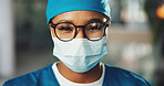Surgeon, woman and portrait with mask in hospital for surgery procedure, healthcare and safety. Professional, doctor and scrubs in clinic for medical support, emergency care and ready for operation