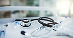 Stethoscope, medical and syringe with instrument in hospital for treatment, cardiology and life insurance. Heart test, healthcare tools and emergency with closeup of equipment in clinic for wellness