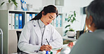 Writing, prescription and doctor with patient, office or notes for assessment, women or appointment. Clinic, mature people and medical professional with notebook for diagnosis, serious and healthcare