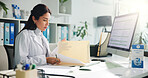 Computer, woman and doctor with paperwork in clinic for research report, diagnosis or treatment. Tech, medical service and female healthcare worker with referral document for notes in hospital office