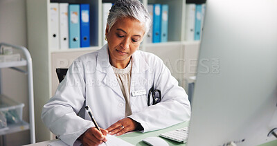 Buy stock photo Computer, woman and doctor writing notes with research in clinic for online report, diagnosis or treatment. Tech, medical service and healthcare worker with paperwork for prescription in office