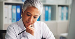 Doctor, woman and serious in office, thinking or research for medical diagnosis, science or project. Healthcare, specialist and mature person with info for treatment plan, reflection and hospital