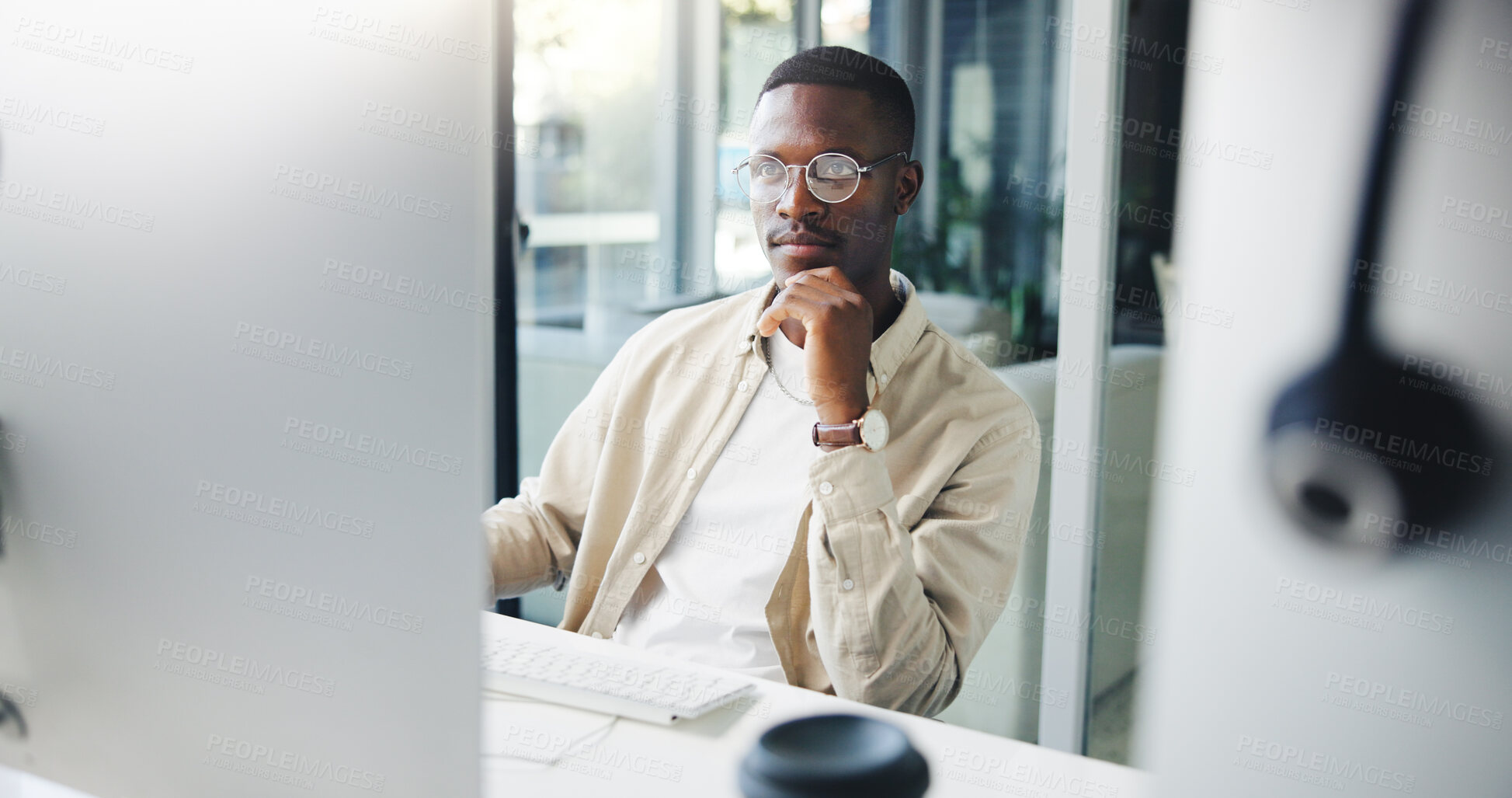 Buy stock photo Thinking, computer and black man in office with ideas, research or brainstorming for creative project. Planning, technology and African male editor working on article for publishing at agency.
