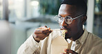 Business, black man or eating by computer in office for working break, reading article and hungry. Media agency, journalist and chinese takeout for nutrition, submission deadline or proofreading blog