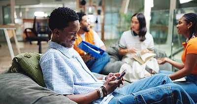 Buy stock photo Education, phone and text message with students in library together for development, learning or study. App, communication and typing with friends on college or university campus for exam preparation