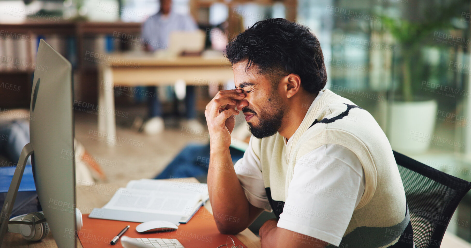 Buy stock photo Frustrated, headache and man at university in library for learning, education and studying. College, school and student with notes, books and pc for project with eye strain, burnout and stress