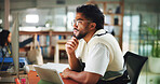 Computer, student and man in library for reading, learning and research project with ideas. University, thinking or male person with technology on campus for education, college literature or studying