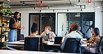 Presentation, speaker and planning with business woman in office for workshop, teamwork and idea. Meeting, collaboration and teaching with employees in agency for support, advice and brainstorming