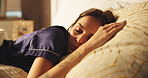 Comfortable, rest and sleeping with woman in bed for morning or weekend break and wellness. Exhausted, fatigue and tired with person asleep in bedroom of apartment for dreaming, nap or recovery