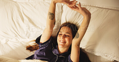 Buy stock photo Above, smile and woman stretching in bed from sleeping, wake up and morning routine to start day. Happy, female person and raised hands for muscle relief, comfortable nap and feeling fresh at house
