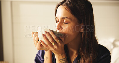 Buy stock photo Woman, drinking and coffee on bed at house for morning start, enjoy espresso and smell aroma. Female person, thinking and beverage for peace, nostalgia memories and herbal tea for wellness in bedroom