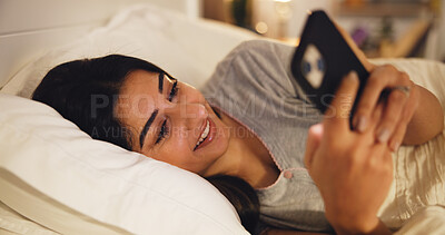 Buy stock photo Woman, bedroom and relax with smartphone for communication, text or online chat. Typing, connection and female person in bed for social media post, update or comment on mobile app at night in home