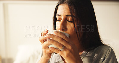 Buy stock photo Woman, drinking and coffee in bedroom at house for morning start, enjoy espresso and smell aroma. Female person, thinking and beverage for peace, nostalgia memories and herbal tea of wellness in home