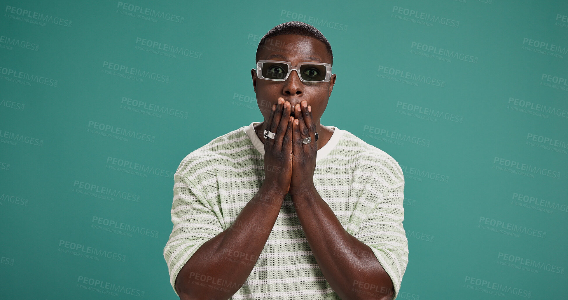Buy stock photo Portrait, sunglasses and black man with surprise, shock or wtf emoji for fashion sale. Wow, rumour and person with omg reaction for secret, discount or gossip with space on green studio background