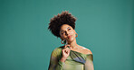 Woman, thinking and fashion in studio with opinion, designer choice and idea for style. African person, afro and accessories on green background space with casual offer, question and making decision