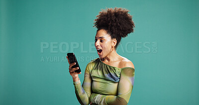 Buy stock photo Surprise, smartphone and woman in studio, wow and announcement on green background. Person, mobile user or cellphone with facial expression, space or shocked with emoji, discount deal or notification