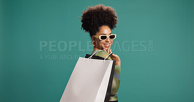 Buy stock photo Confident, fashion and woman with shopping bag, studio or happy for discount, mockup space and gift. Green background, shopper and African person with products on sale, smile and customer with shades