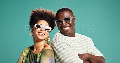 Buy stock photo Fashion, arms crossed and couple or people in studio for style, sunglasses and support. Happiness, trendy and clothes pride with African man and woman on green background for love and eyewear