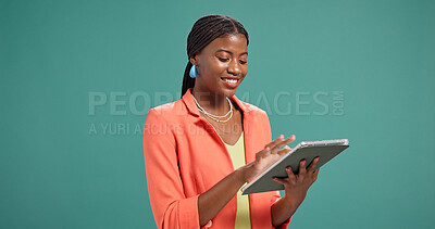 Buy stock photo Smile, black woman and tablet for fashion in studio for research, ecommerce or update website. Happy, female designer and digital for advertising, clothes feedback and information on green background