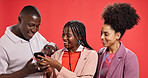 Happy, smartphone and friends in studio, group and internet for social media on red background. People, man and women with cellphone, funny meme and laugh with online humor, digital app and happiness