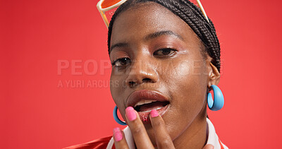 Buy stock photo Black woman, portrait and lips with makeup in studio for fashion on a red background. Face, female person or African model with beauty cosmetics, cool accessories or style for cosmetology on space