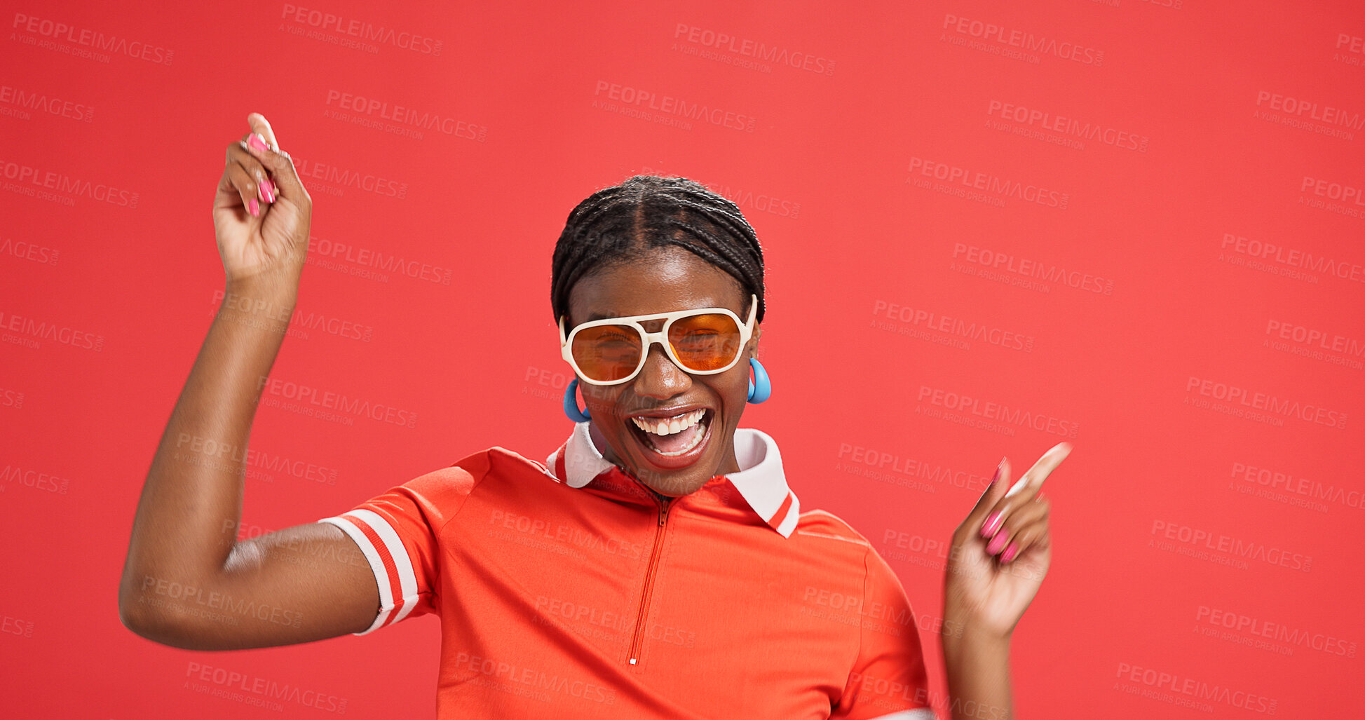 Buy stock photo Happy, fashion and black woman pointing in studio for discount news, announcement and sale. Excited, promotion and portrait of person with trendy clothes, sunglasses or outfit on red background space
