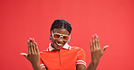 Happy, portrait or black woman with fashion accessories in studio for style on a red background. Female person, African model or smile with sunglasses, nails or clothing for cosmetics on mockup space