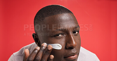 Buy stock photo Apply, studio or portrait of black man with face cream for skincare, glow or facial beauty. Space, red background or African male model with moisturizer for lotion, sunscreen cosmetics or protection