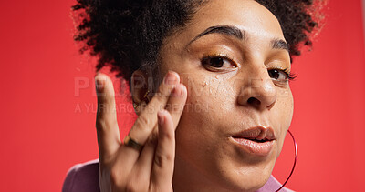 Buy stock photo Woman, face and cream for skincare, hydration and moisturizer treatment with cosmetics in studio. Portrait, person and model with product for facial lotion, glow or wellness on red background